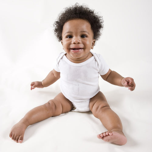 White cotton baby onesies 2-pack with short sleeves displayed on clean minimal surface