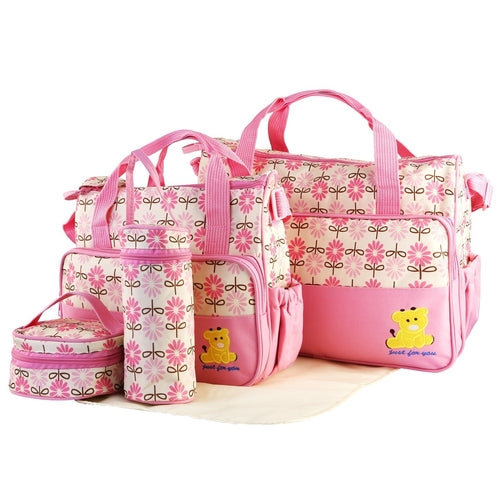 Complete 5-piece diaper bag set with accessories and pouches arranged to show all components